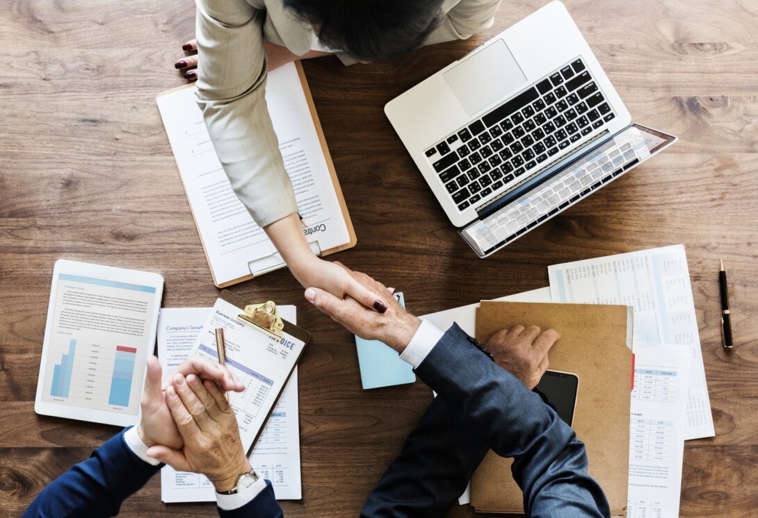 M&A Law Firm in India - Mergers & Acquisitions Legal Experts Mergers and Acquisitions - Corporate M&A deal negotiation and handshake